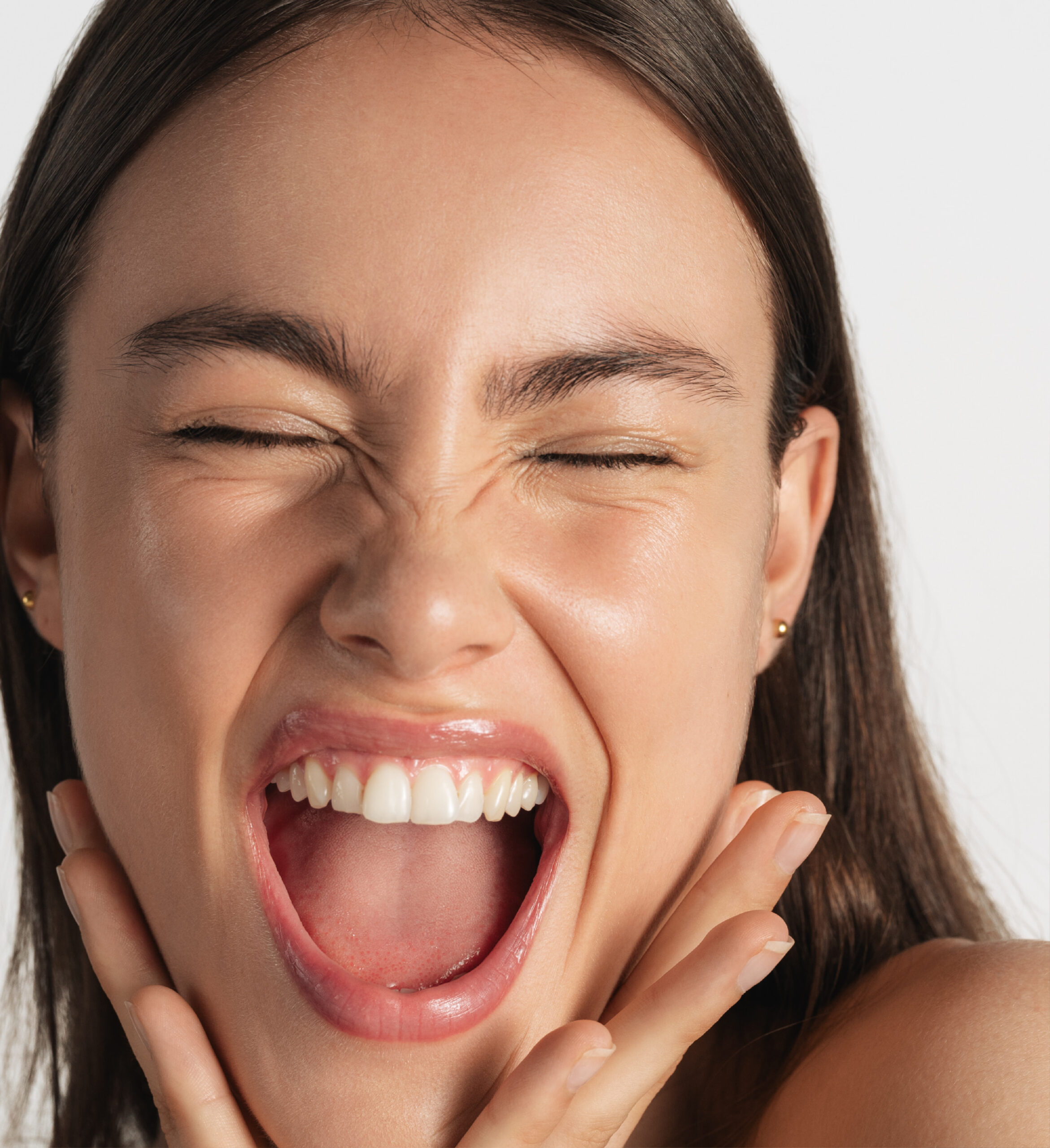 Smiling model with glowing skin using Innovyal skincare