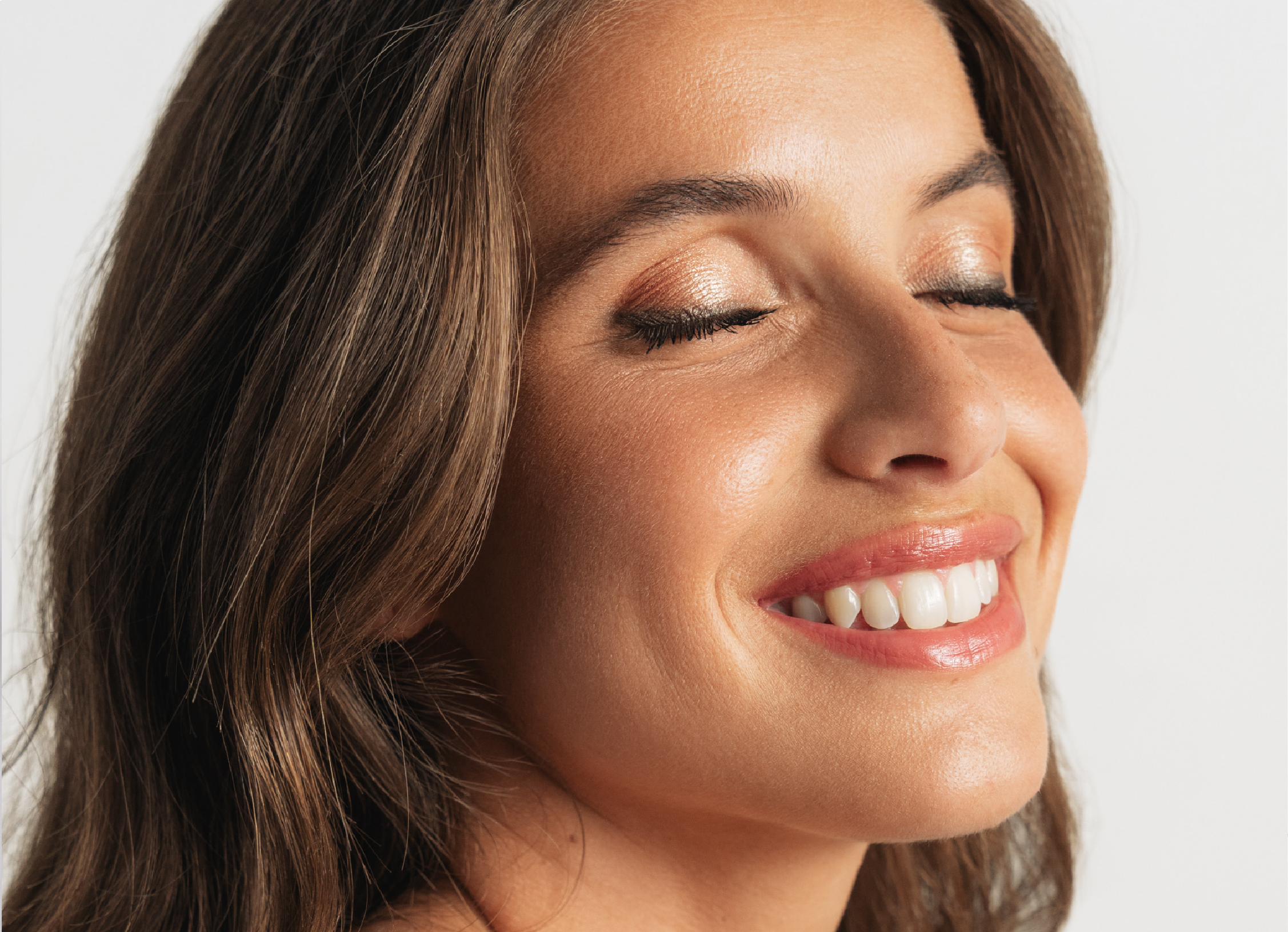 Smiling woman with glowing skin, Louna skincare